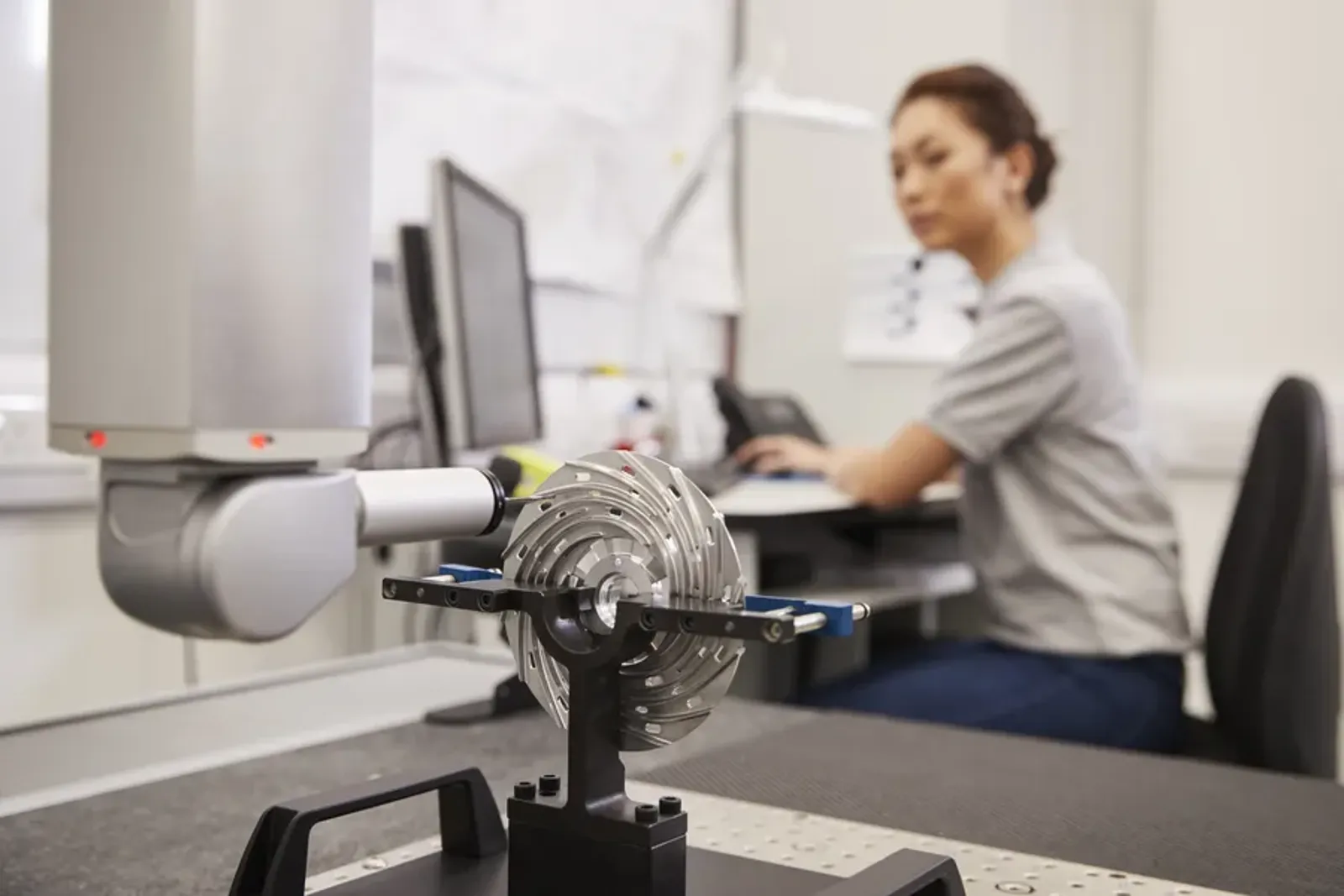 Engineer using a coordinate measuring machine